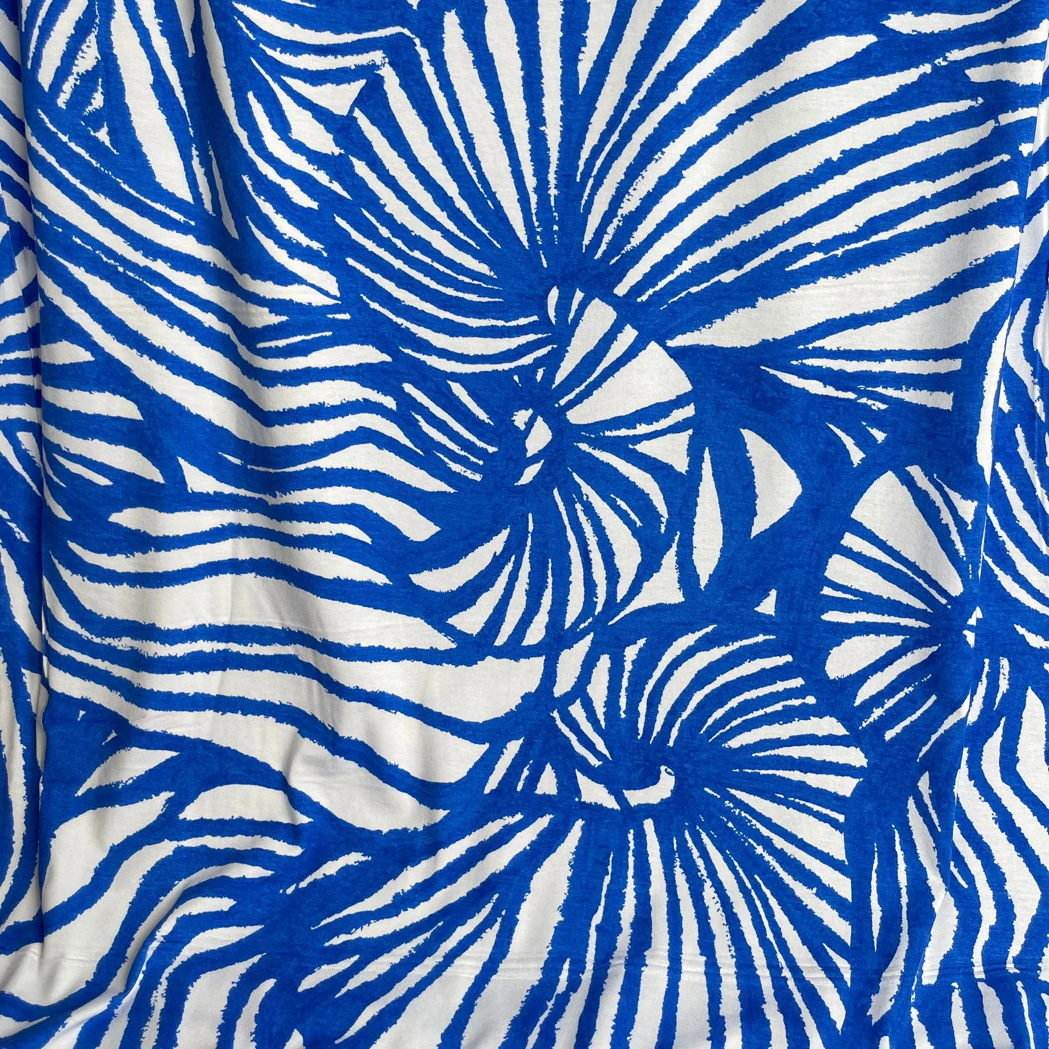Ex-Designer Deadstock Ammonite Fossils on Blue Viscose Jersey Fabric