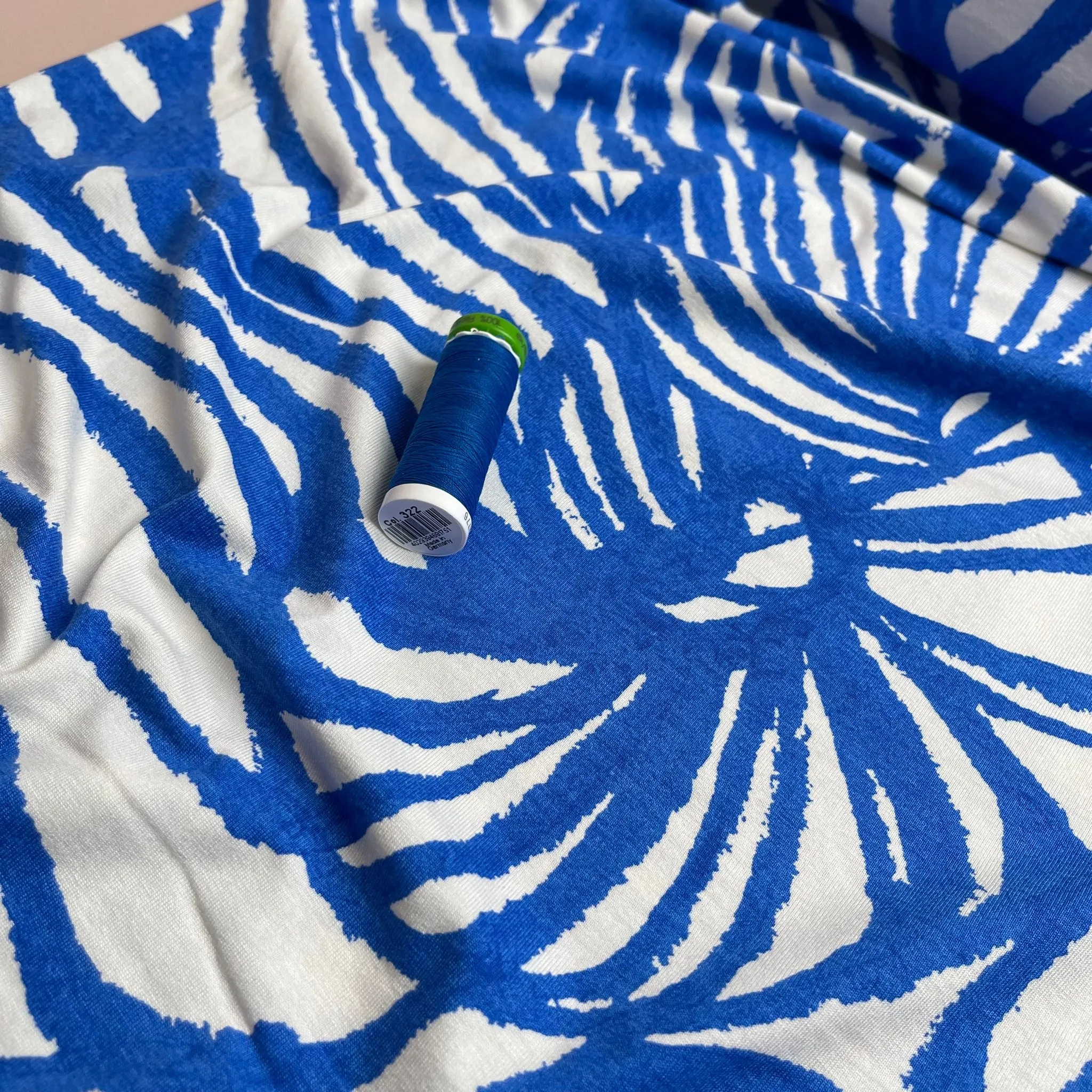 Ex-Designer Deadstock Ammonite Fossils on Blue Viscose Jersey Fabric