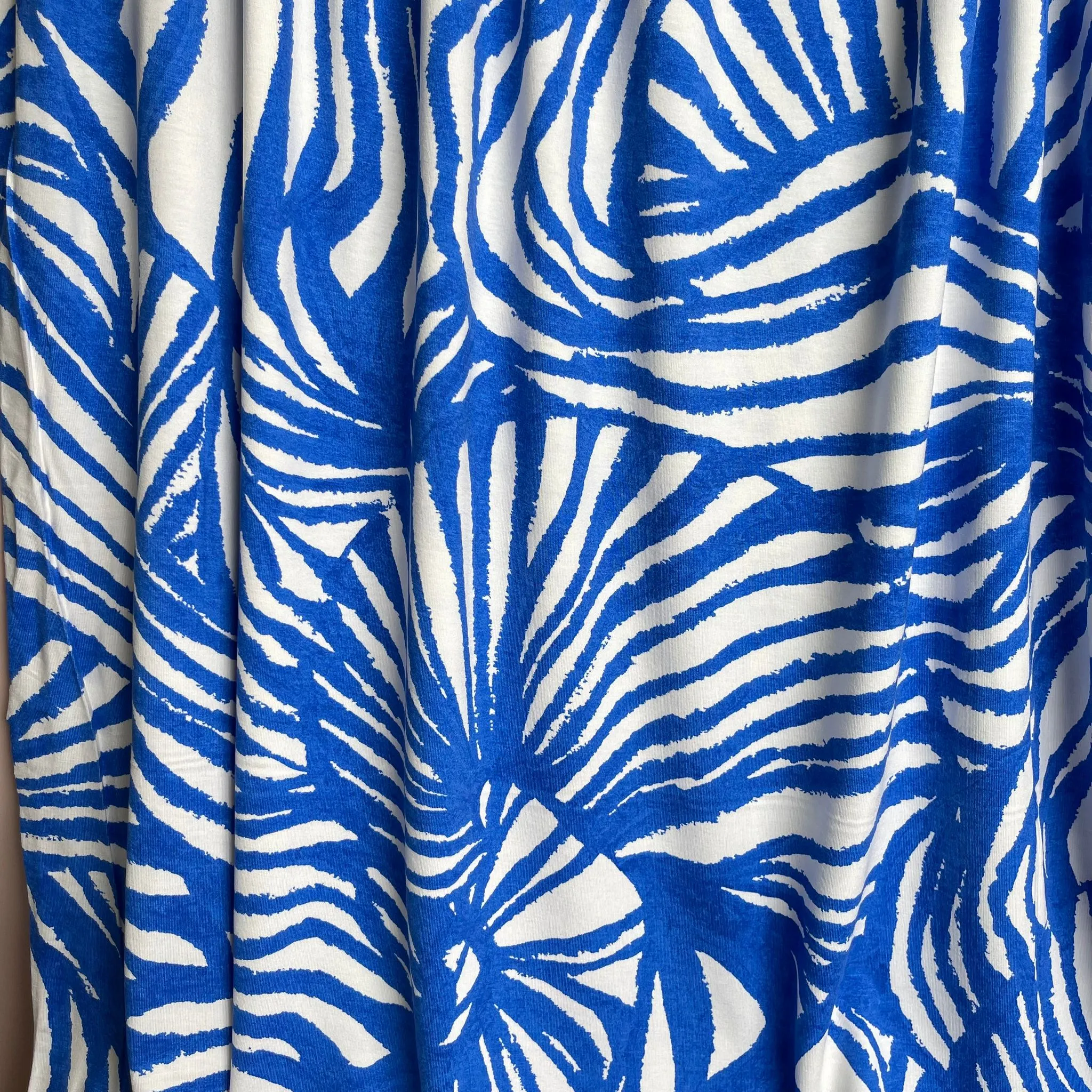 Ex-Designer Deadstock Ammonite Fossils on Blue Viscose Jersey Fabric