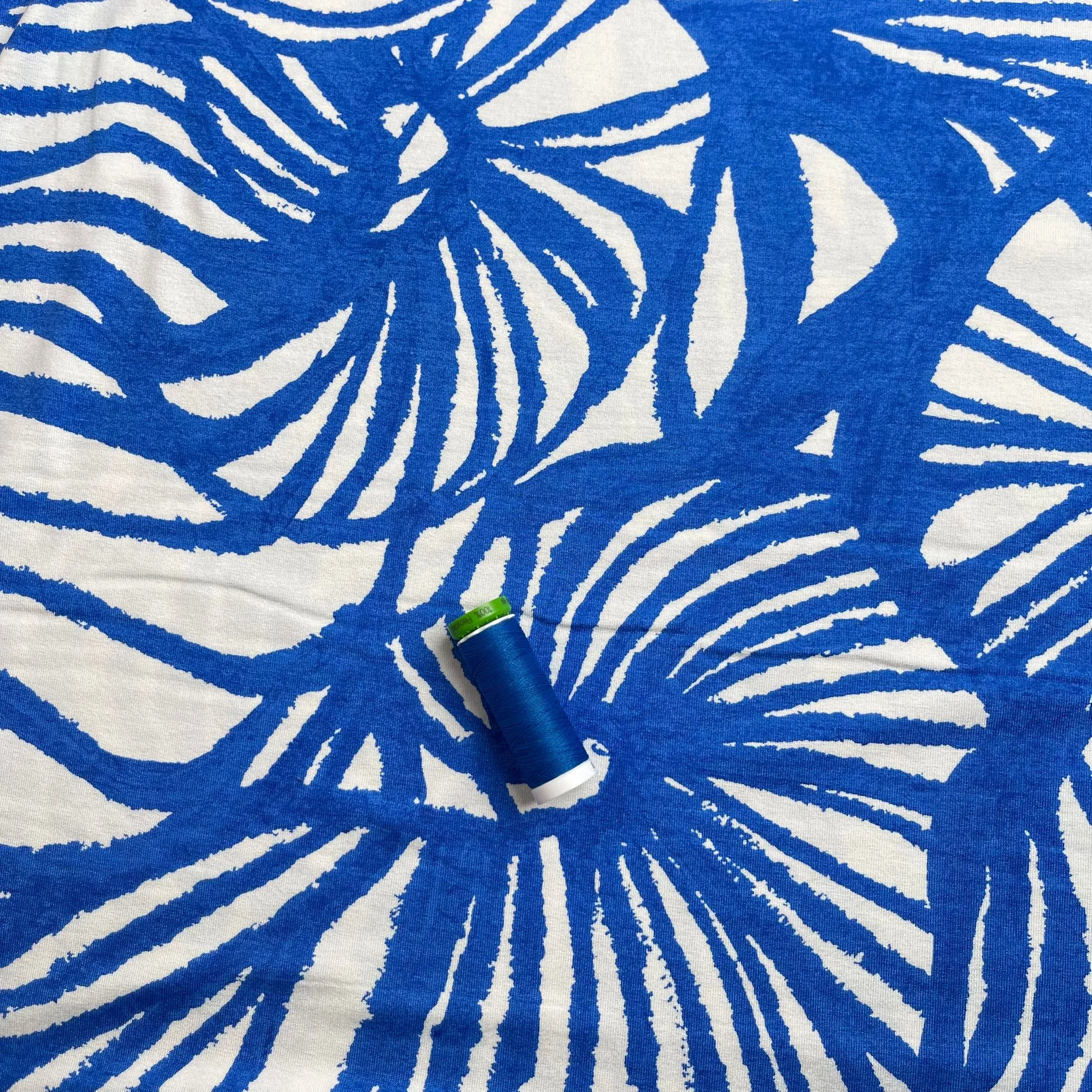 Ex-Designer Deadstock Ammonite Fossils on Blue Viscose Jersey Fabric