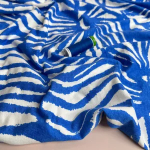 Ex-Designer Deadstock Ammonite Fossils on Blue Viscose Jersey Fabric