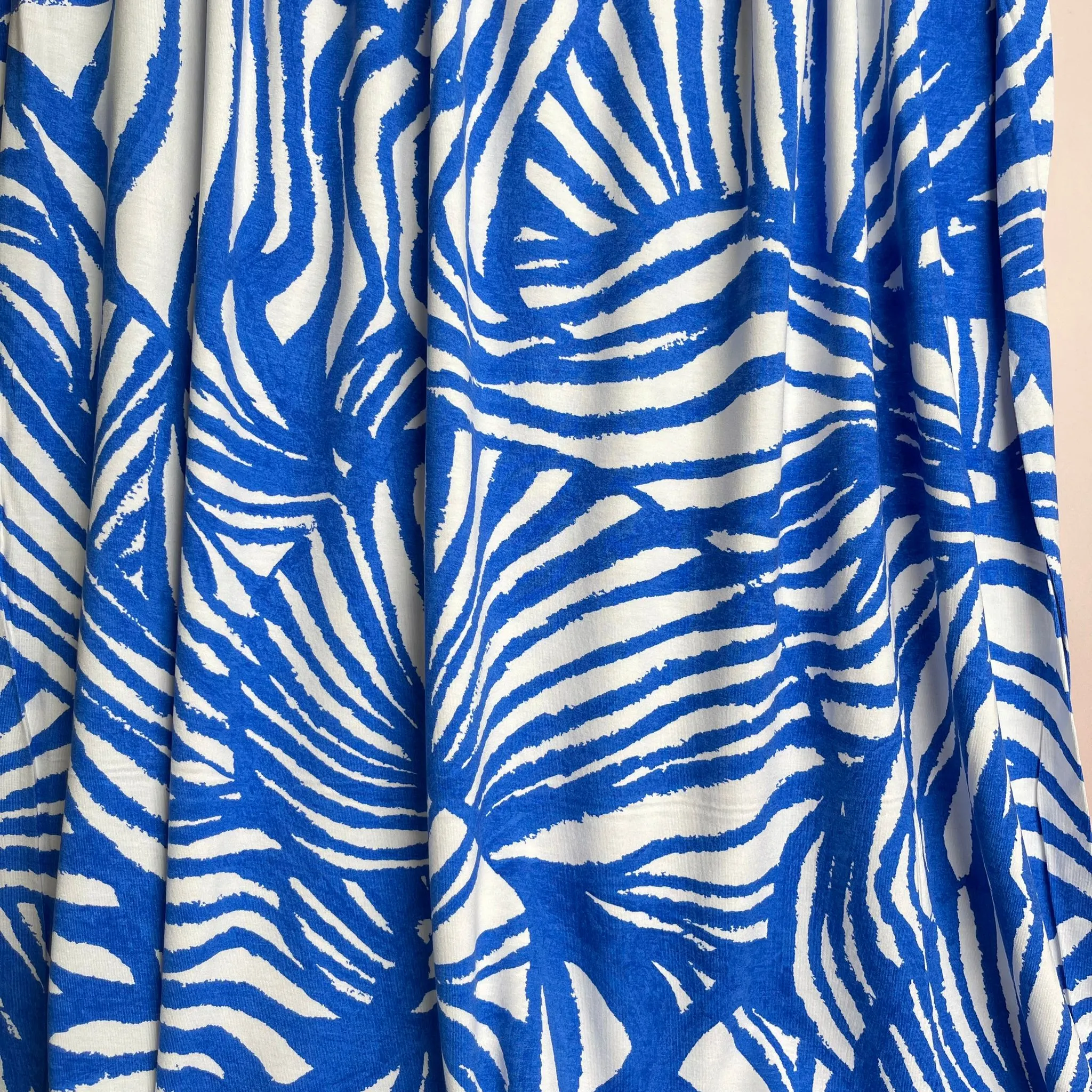 Ex-Designer Deadstock Ammonite Fossils on Blue Viscose Jersey Fabric